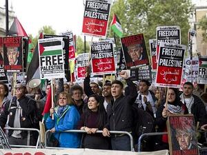 Pro-Palestinian demonstrators shout slogans as they gather to a protest outside the gates of Downing Street in London. (AFP/ File Photo)