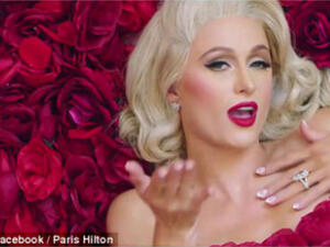 Paris Hilton sent temperatures soaring as she released the sizzling new music video for the loved-up song - with her fiance Chris Zylka serving as director.