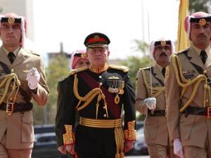 JORDAN, Amman : In a handout picture released by the Jordanian Royal Palace, Jordan&#039;s King Abdullah II marches with an honour guard to open the autumn session of the Jordanian parliament in the capital Amman on October 5, 2008