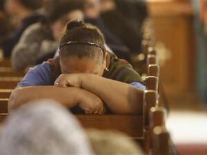 Egyptian Coptic Christians mourn during Sunday mass on January 2, 2011 at the Al-Qiddissine (The Saints) church in Alexandria which was targeted on New Year's Eve by a car bomb attack in which 21 people were killed.