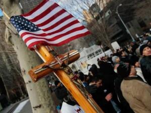 A cross is held by a supporter of Egypt's Coptic Christian community during a protest near the United Nations against the Egyptian government's treatment of its Christian minority December 14, 2010 in New York City