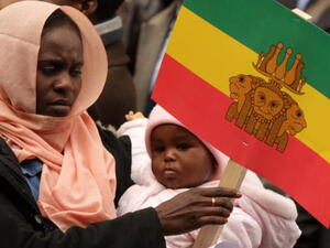 LONDON, ENGLAND - MARCH 04: Protesters campaigning for the indictment of Sudan&#039;s president Omar al-Bashir demonstrate outside the Sudanese embassy on March 4, 2009 in London