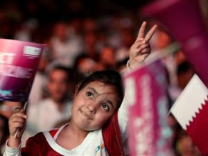 A Qatari girl celebrates in Doha after the tiny Gulf state was chosen to host the 2022 World Cup on December 2, 2010