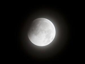 A picture taken in New York shows the moon in the early stages of a lunar eclipse on December 21, 2010. This eclipse is notable because it takes place just hours before the December solstice, which marks the beginning of northern winter and southern summer.