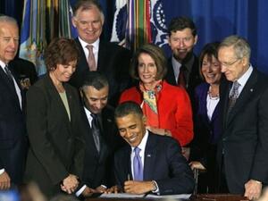 WASHINGTON, DC - DECEMBER 22: U.S. President Barack Obama (C) signs legislation repealing military policy law during a ceremony December 22, 2010 in Washington, DC. President Obama signed into law a bill repealing the "don't ask, don't tell" law against gays serving openly in the military