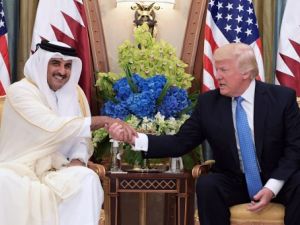 This file photo taken on May 21, 2017 shows US President Donald Trump (R) speaks with Qatar's Emir Sheikh Tamim Bin Hamad Al-Thani, during a bilateral meeting at a hotel in the Saudi capital Riyadh. 
 