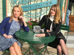The picture shows Witherspoon and Dern sitting outside Seaside Coffee Shop in Monterey, Calif. Witherspoon wears a blue dress with a cardigan, while Dern sports a white turtleneck with a black skirt and cropped jacket. (Source: lauradern - Instagram)
