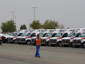 A member of Saudi Red Crescent Authority (SRCA) walks past ambulances waiting at the Hajj pilgrimage in Mecca, Saudi Arabia, on September 6, 2016. (AFP/Ahmad Gharabli)