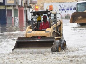 A Saudi worker clears a flooded street in Riyadh. (AFP/Fayez Nureldine) A Saudi worker clears a flooded street in Riyadh. (AFP/Fayez Nureldine)
