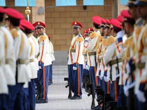 SAUDI ARABIA, Riyadh : Saudi royal honor guards smile as they attend the ceremony of the Eid al-Fitr prayer at Turki bin Abdullah grand mosque in Riyadh, on August 8, 2013. AFP PHOTO/FAYEZ NURELDINE