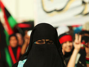  Libyan girl wearing a niqab during the demonstrations against the regime of Gaddafi in Bayda, Libya (Wikimedia Commons)