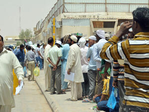 Expatriates wait to correct work documents outside the Saudi Labour Ministry (Source: AFP file photo)