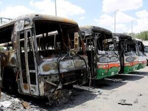 Buses allegedly torched by disgruntled Binladin construction workers. (Telesurtv.net)
