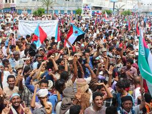 Supporters of the southern separatist movement wave the movements flag during a rally in Yemen. (AFP/File) Supporters of the southern separatist movement wave the movements flag during a rally in Yemen. (AFP/File)