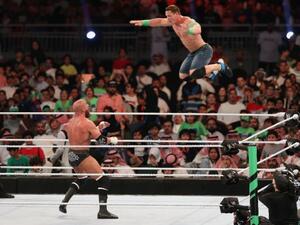 John Cena (R) competes with Triple H during the World Wrestling Entertainment (WWE) Greatest Royal Rumble event in the Saudi coastal city of Jeddah (AFP Photo/STRINGER)
