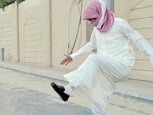 A Saudi student stomps on shredded books after exams. (File photo)