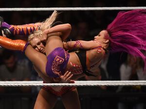 WWE wrestling stars Sasha Bank (R) and Charlotte Flair (L) fight during a WWE women's fight.. (AFP/ File Photo)