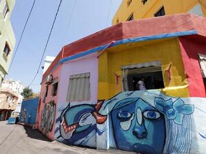 The “Alfan Sharqy” exhibit in Bayoonya opened on Monday and is believed to be the first street graffiti project in the Kingdom. (AFP/ File Photo)