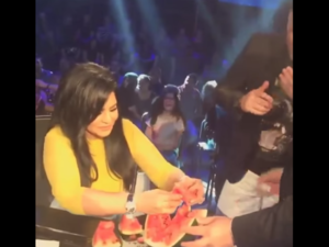 A still of Ahlam eating watermelon live on air on the "Golden Mic" show. (YouTube still)