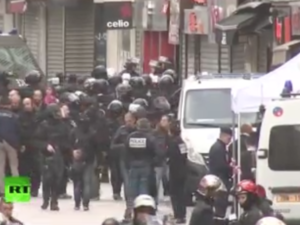 A live feed shows the police raid on a Saint Denis flat that's been underway since early Wednesday morning. 