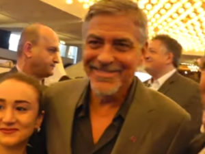 Clooney poses for selfies with fans in Armenia. (YouTube)