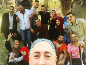 Alan with a group of Syrian refugees in Lebanon. (Instagram)