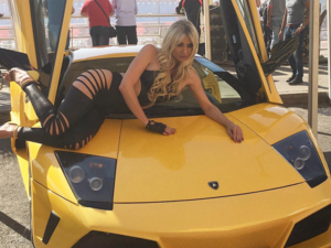 Myriam posing with a yellow Lambo. (Instagram)