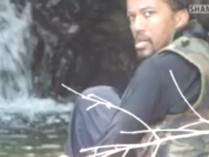 A shaky still from the video that shows German Abu Talha praying and playing in the Syrian Latakia province. (YouTube)