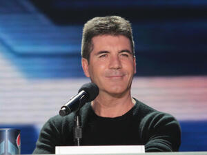 Simon Cowell hopes his young son Eric will be in a boyband when he's older. (Source: s_bukley / Shutterstock)