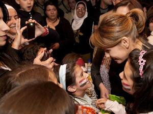 Asma Assad and her children attend a fundraising event in Damascus