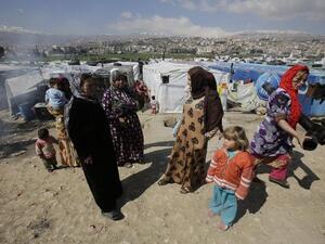 Syrian refugees at a makeshift camp in Lebanon (AFP)