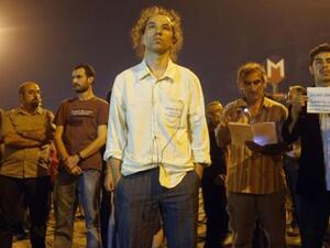 Erdem Gundus, pictured here, sparked a protest by standing silently for hours in Taksim Square in Istanbul overnight. He is currently trending on Twitter under the hashtag #StandingMan.