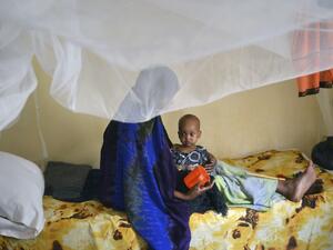 A malnourished child is fed a special formula by her mother at a hospital in Baidoa town in southwestern Somalia that has been hit by severe cases of malnourishment and cholera on March 15, 2017. (AFP/Tony Karumba)
