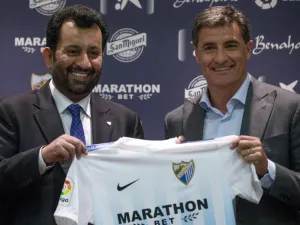 Malaga's new coach Jose Miguel Gonzalez Martin del Campo aka Michel (R) poses with Malaga CF's chairman Sheikh Abdallah Ben Nasser Al-Thani during his official presentation at the Rosaleda stadium in Malaga, on March 8, 2017.
JORGE GUERRERO / AFP