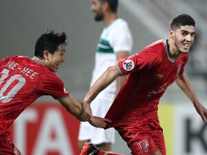 Qatar's Al-Duhail Karim Boudiaf (R) and Nam Tae-hee celebrate scoring against Iranian Zobahan club during their AFC Champions League match between Al-Duhail against Zob Ahan at the Abdullah bin Khalifa Stadium in Doha on February 12, 2018.
KARIM JAAFAR / AFP
