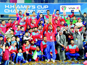 The Amir Cup champions Al-Kuwait Football Club celebrate with officials and fans. (Photo: Arab Times)