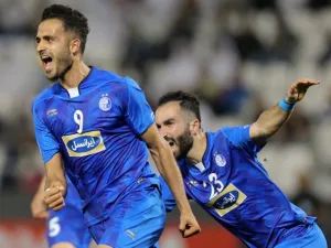 Esteghlal FC's Iranian forward Ali Ghorbani (L) celebrates with his teammates after scoring a goal against Al-Rayyan SC during their Asian Champions League football match at Jassim Bin Hamad Stadium in the Qatari capital Doha on February 13, 2018.
KARIM JAAFAR / AFP