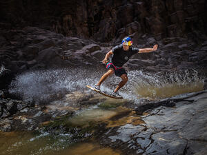 Wakeskating champion and Red Bull athlete Brian Grubb, battles the unforgiving water streams in a volcanic narrow valley In the Jordanian Desert.