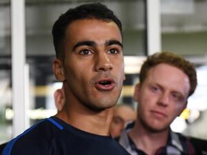 Footballer Hakeem al-Araibi (L) speaks to the media upon his arrival at the airport in Melbourne on February 12, 2019. Refugee footballer Hakeem al-Araibi made a triumphant return to Australia on February 12, ending a two month ordeal that saw him jailed in Thailand and threatened with forced return to his native Bahrain.
WILLIAM WEST / AFP
