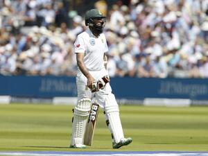 South Africa's Hashim Amla walks back to the pavilion after losing his wicket on the second day of the first Test match between England and South Africa at Lord's Cricket Ground in central London on July 7, 2017.
Ian KINGTON / AFP