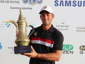 Jamie Elson with the trophy after winning the Ayla Golf Championship on Saturday. (AN photo)