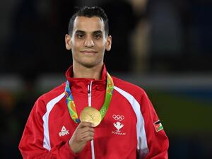 Jordan's Ahmad Abughaush poses with his gold medal on the podium after the men's taekwondo event in the -68kg category as part of the Rio 2016 Olympic Games, on August 18, 2016, at the Carioca Arena 3, in Rio de Janeiro.
Kirill KUDRYAVTSEV / AFP