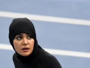 Saudi Arabia's Kariman Abuljadayel looks at the results board after competing in the Women's 100m Preliminary Round during the athletics event at the Rio 2016 Olympic Games at the Olympic Stadium in Rio de Janeiro on August 12, 2016.
PEDRO UGARTE / AFP