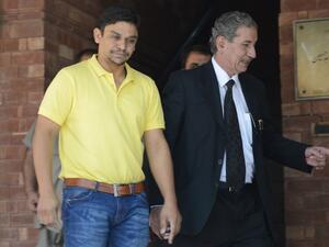 Suspended Pakistani cricketer Khalid Latif (L) and his lawyer leave the High Court building in Lahore on April 14, 2017.
ARIF ALI / AFP