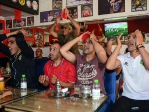 Moroccan football supporters react as they watch their national team play in their Russia 2018 World Cup Group B football match against Portugal at a sports cafe in Marrakech on June 20, 2018.
ABDERRAHMANE MOKHTARI / AFP