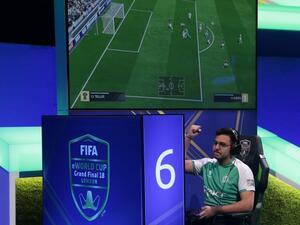 Player Mossad Aldossary competes in the group stages of the FIFA eWorld Cup Grand Final, at the O2 in London on August 2, 2018. The FIFA eWorld Cup Grand Final 2018 will see 32 finalists battle it out for the main prize – the title of FIFA eWorld Cup champion, and pocket USD 250,000 in prize money.
Daniel LEAL-OLIVAS / AFP