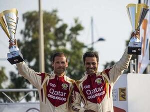 Qatar’s Nasser al-Attiyah (right) and co-driver Mathhieu Baumel celebrate their Cyprus Rally win. (Photo: Gulf Times)