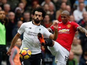 جانب من الصراع الثنائي بين يانغ (يمين) وصلاح 