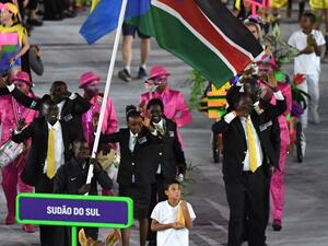 South Sudan's flagbearer Guor Marial leads his delegation during the opening ceremony of the Rio 2016 Olympic Games at the Maracana stadium in Rio de Janeiro on August 5, 2016.
PEDRO UGARTE / AFP