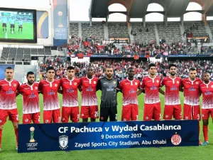 Members of Wydad Casablanca's team pose before the start of their FIFA Club World Cup quarter-final match against CF Pachuca at Zayed Sports City Stadium in the Emirati capital Abu Dhabi on December 9, 2017.
GIUSEPPE CACACE / AFP